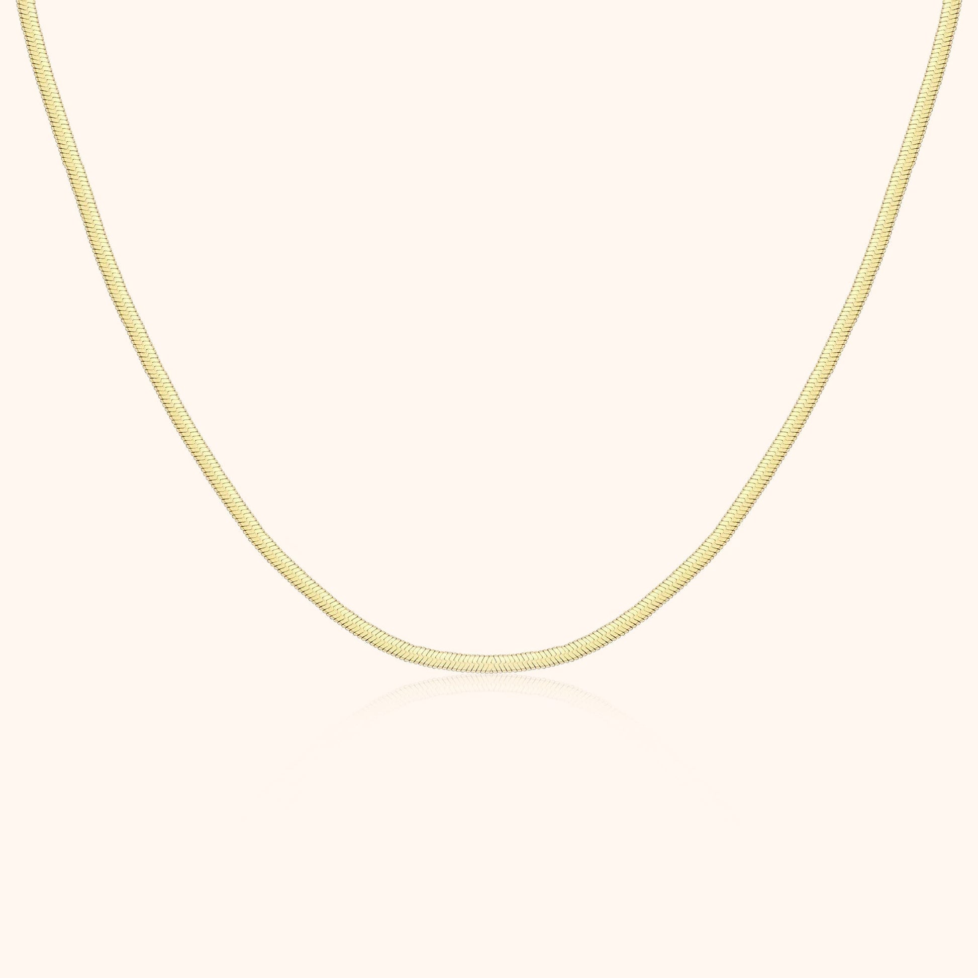 Goldene Schlangenkette, 18 Karat, elegantes Design, Schmuck für Damen, luxuriöses Accessoire.