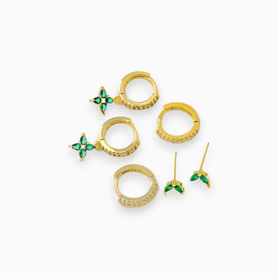 Goldene Ohrringe Set mit grünen Edelsteinen, modisches Schmuckdesign, eleganter Stil.