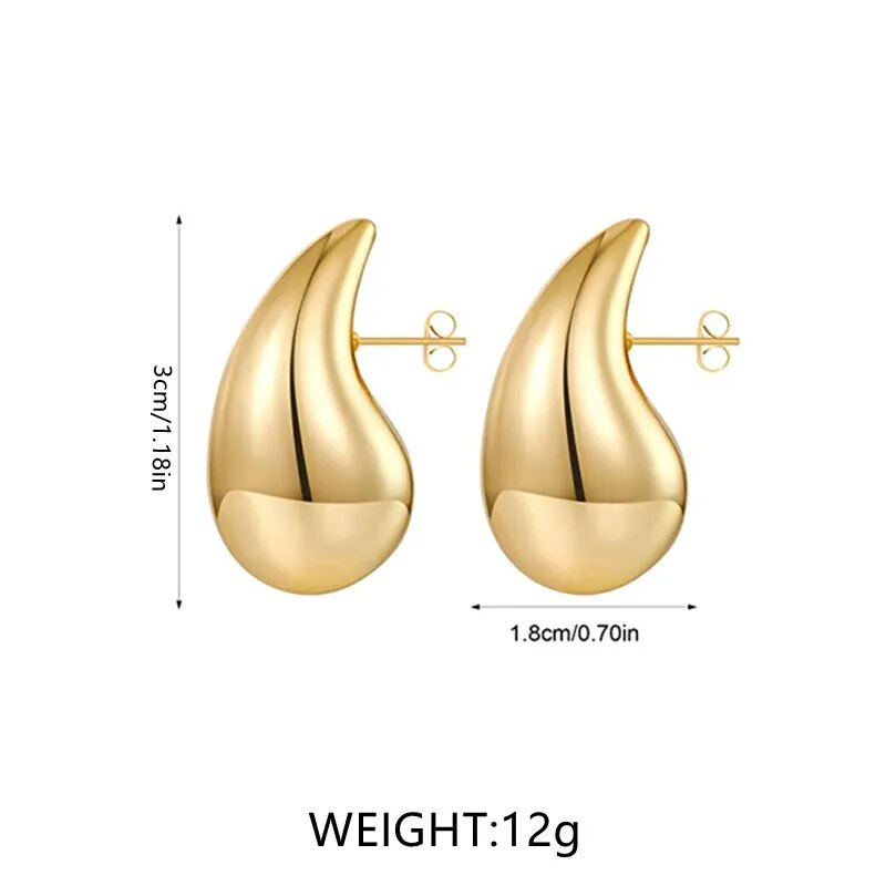 Goldene Ohrringe, tropfenförmig, 3cm x 1.8cm, 12g, modisch, elegant, Schmuckaccessoire.
