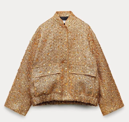 Goldene Damenjacke aus Tweed mit Pailletten, modisch, elegant, Herbstmode, stilvoll.