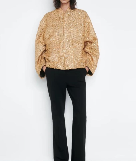 Goldene Paillettenjacke Damen, elegant, modisch, übergroß, schwarze Hose, Abendmode.