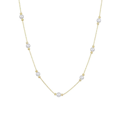 Goldene Halskette mit weißen Perlen, elegantes Schmuckdesign, Damenaccessoire, modisch.