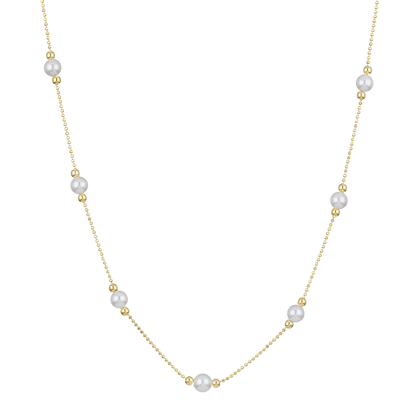 Goldene Halskette mit Perlen, elegantes Schmuckstück, Damenmode, luxuriöses Accessoire.