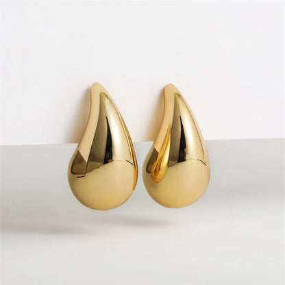 Goldene Tropfen-Ohrringe, glänzend, elegant, Modeschmuck, Damenaccessoire, Geschenkidee.