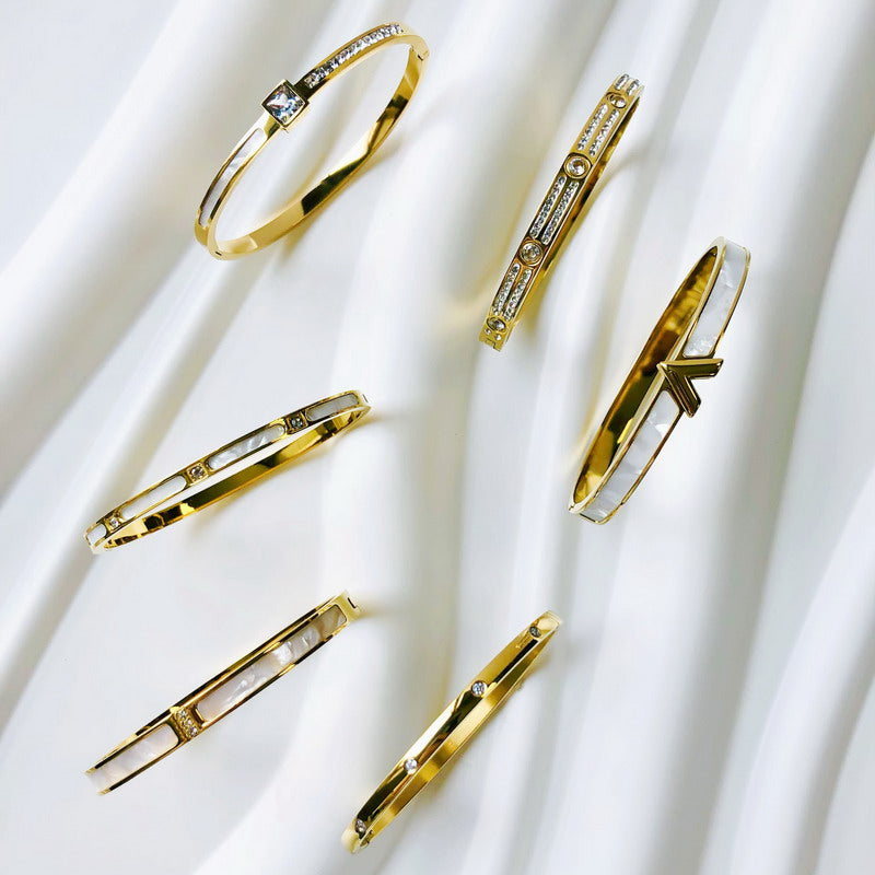 Goldene Edelstahl-Armbänder mit Zirkon, wasserdicht, luxuriöses Design für Damen.