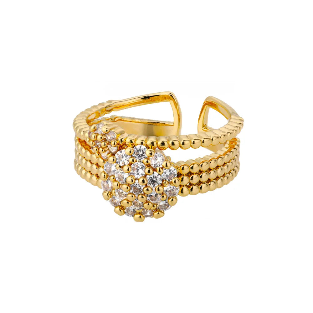 Goldener Ring mit Perlenstruktur und funkelndem Kristallblumen-Design, eleganter Schmuck.