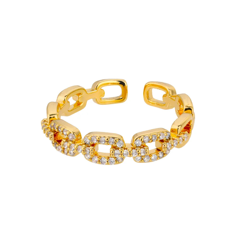 Goldener Ring mit Kettengliedern und Zirkonia-Steinen, eleganter Schmuck für Damen.