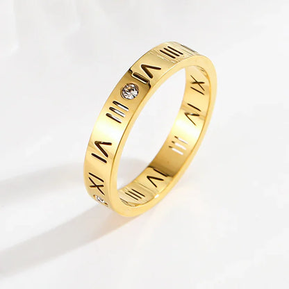 Goldener Ring mit römischen Ziffern und Kristallen, modisches Schmuckstück für Damen.