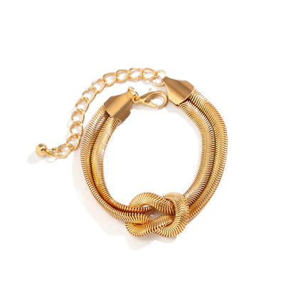 Goldenes Armband mit Knoten-Design, verstellbar, Edelstahl, modisches Schmuckstück.