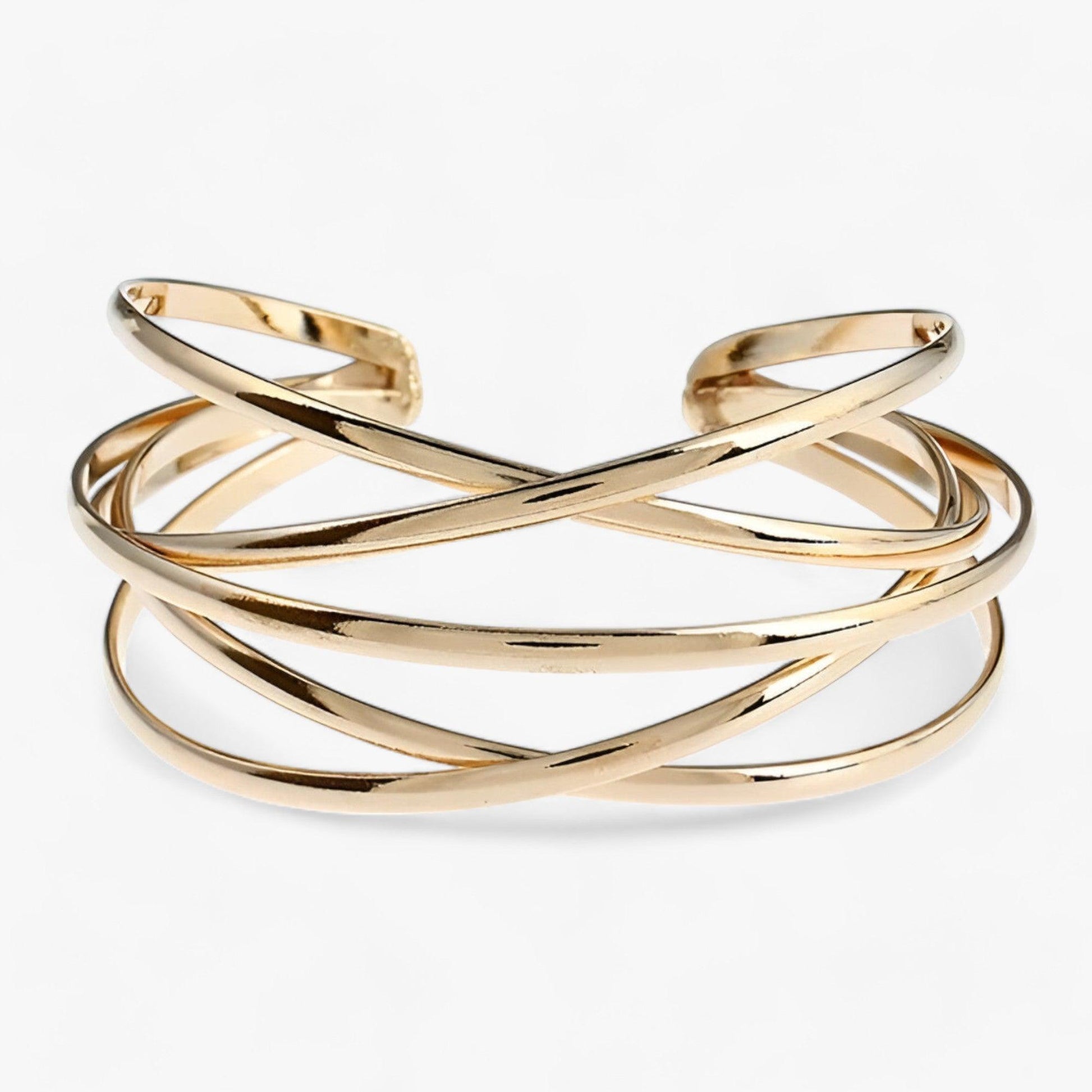 Goldenes Armreif-Design, überkreuzte Streifen, eleganter Schmuck, modisches Accessoire.