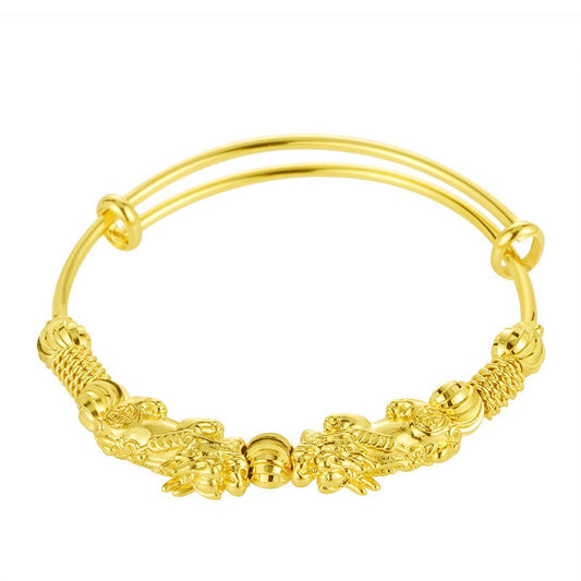 Goldenes Armband mit Drachenmotiv, verstellbar, aus Metall, elegantes Schmuckstück.