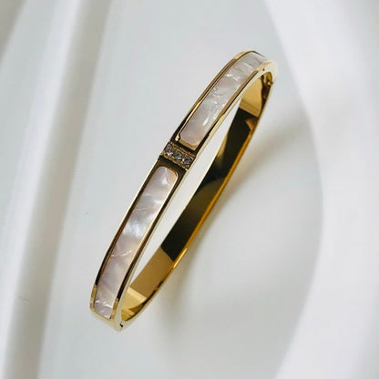 Goldener Edelstahl-Armreif mit Zirkon, wasserdicht, luxuriöses Design für Damen.