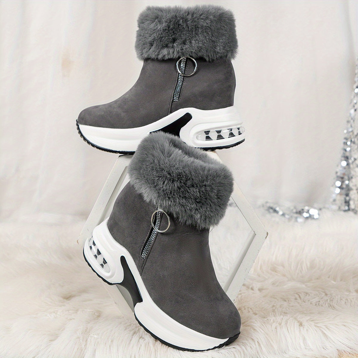 Graue Damen-Winterstiefel mit Fellbesatz, Keilabsatz und Reißverschluss, modisch und warm.
