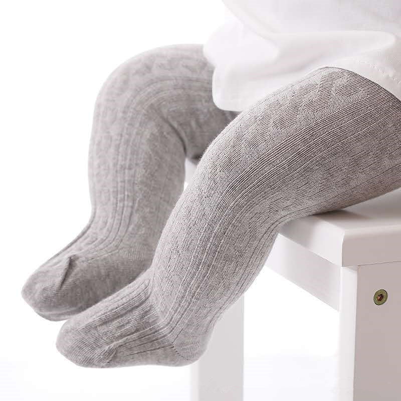 Graue Baby-Strumpfhose aus Baumwolle, weiches Material, ideal für Herbst und Winter.
