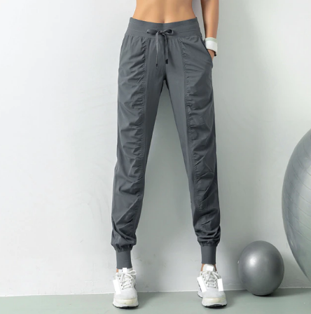 Graue Damen-Sporthose, atmungsaktiv, elastisch, ideal für Fitness und Yoga.