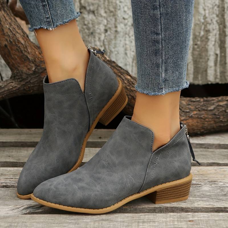 Graue Damen-Stiefeletten aus Leder, niedriger Absatz, modisch, bequem, Herbstmode.