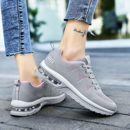 Graue Damen-Sneaker mit Luftpolstersohle, atmungsaktiv, ideal für Laufen und Freizeit.