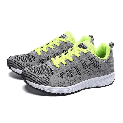 Graue Damen-Sneaker, atmungsaktiv, leicht, Outdoor-Sportschuhe, gelbe Schnürsenkel.