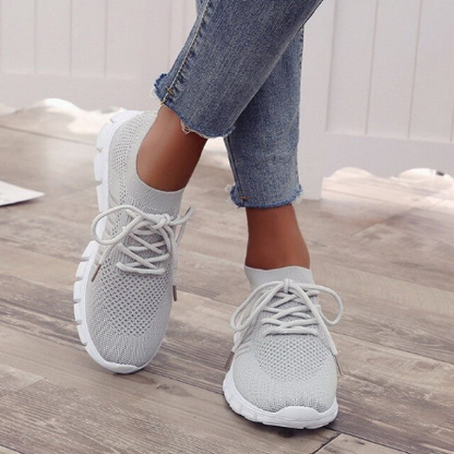 Graue Damen-Sneaker aus Mesh, bequem, atmungsaktiv, ideal für Freizeit und Sport.