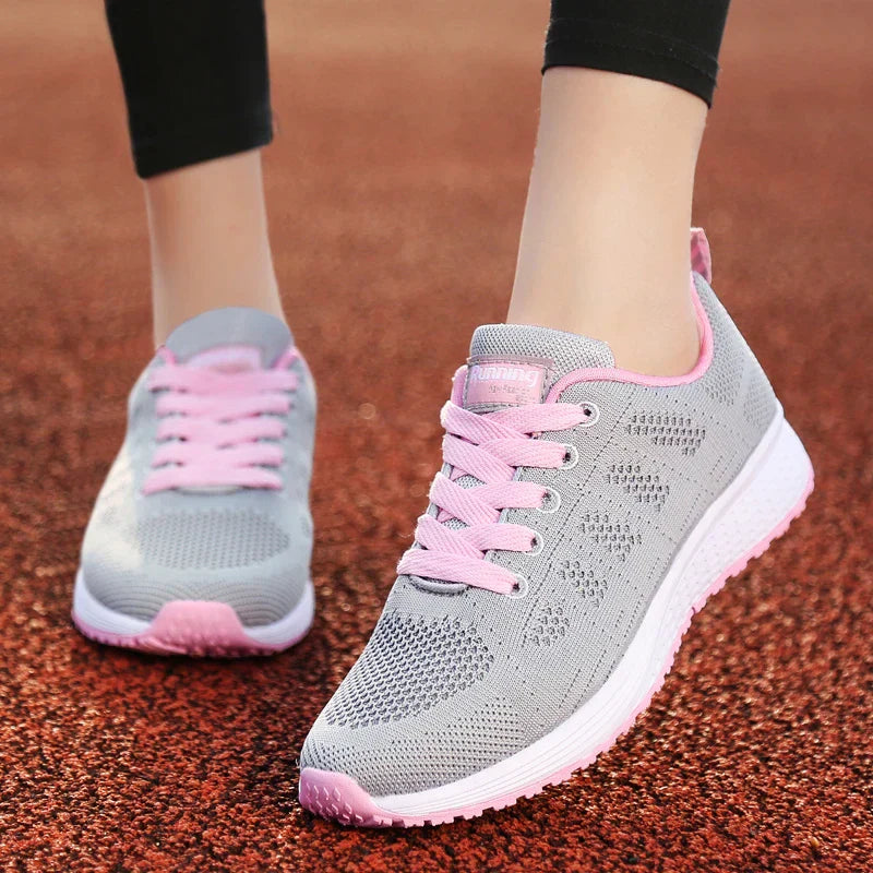 Graue Damen-Sneaker mit rosa Schnürsenkeln, atmungsaktiv, leicht, für Outdoor-Aktivitäten.