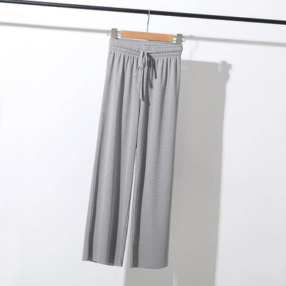 Graue Damenhose aus Baumwolle mit elastischem Bund und Kordelzug, lässiger Stil.