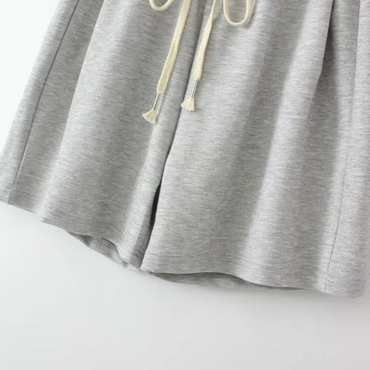 Graue Jogginghose aus Baumwolle mit Kordelzug, bequeme Sportbekleidung für Damen.