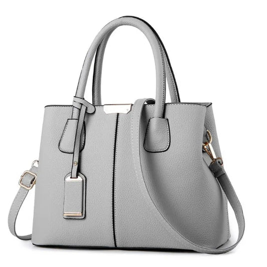 Graue Damenhandtasche aus Leder mit Schulterriemen, elegant und modern, für Alltag und Büro.