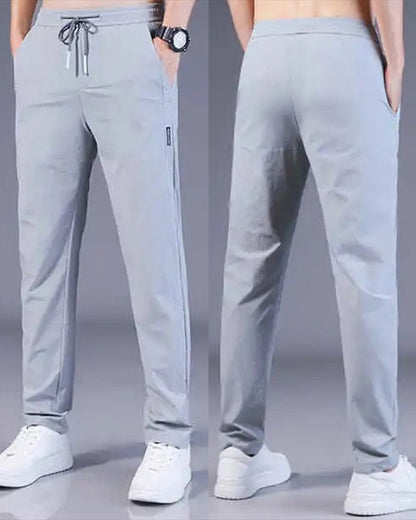 Graue Herren-Sporthose, atmungsaktiv, elastisch, ideal für Fitness und Freizeit.