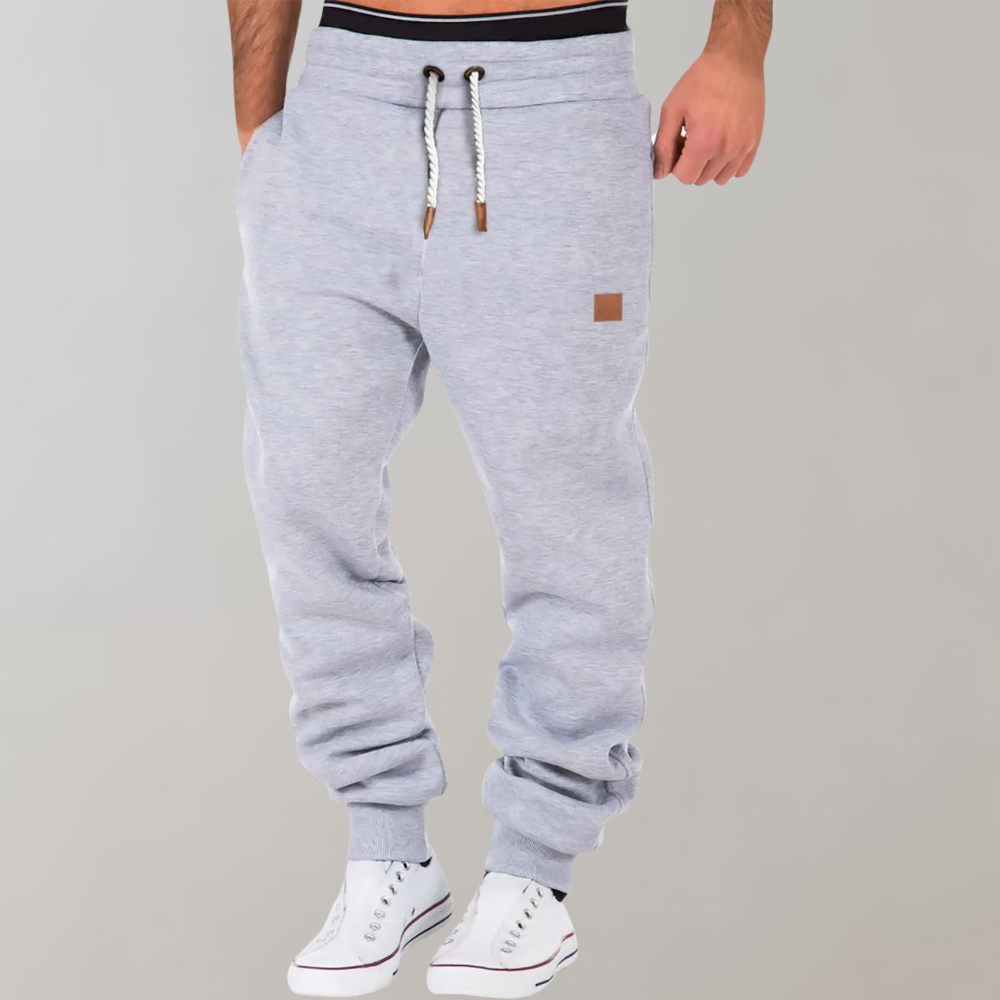 Graue Herren-Jogginghose mit Kordelzug, bequem, sportlich, Baumwolle, ideal für Freizeit.
