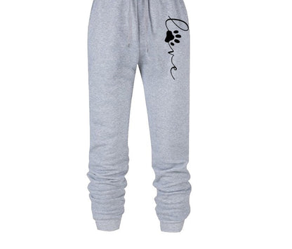 Graue Jogginghose mit Pfotenabdruck und "Love"-Schriftzug, bequem, Baumwolle, Damenmode.
