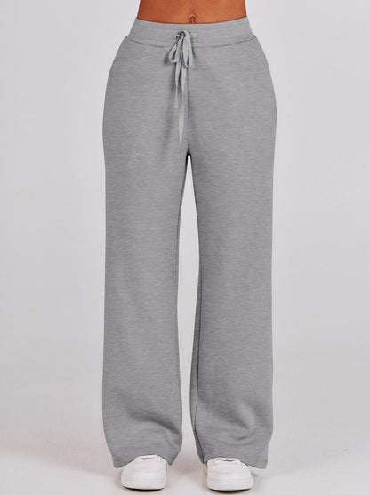 Graue Damen-Jogginghose, bequem, mit Kordelzug, aus Baumwolle, ideal für Freizeit und Sport.