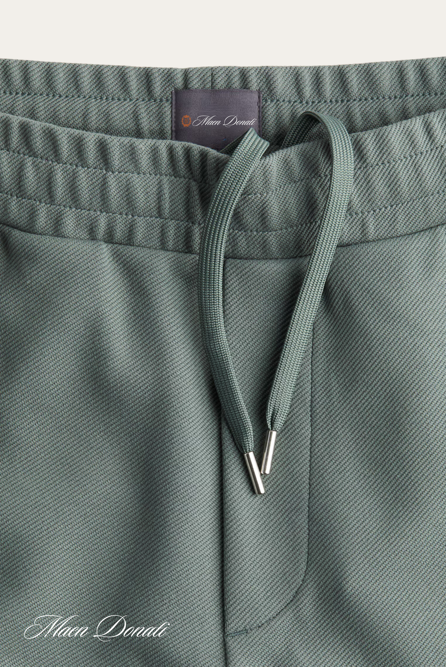 Grüne Jogginghose aus Baumwolle mit Kordelzug, bequeme Sportbekleidung für Herren.