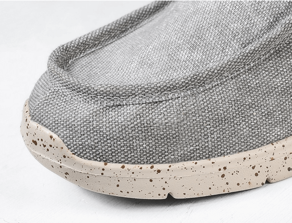 Graue Leinen-Loafer mit gesprenkelter Sohle, bequeme Freizeitschuhe für Herren.