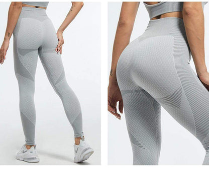 Graue nahtlose Leggings, figurformend, hoher Bund, Sportbekleidung, Damenmode.