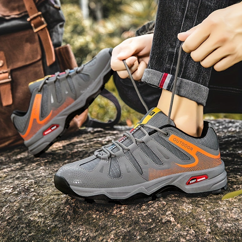 Graue Outdoor-Wanderschuhe, atmungsaktiv, rutschfest, ideal für Trekking und Abenteuer.