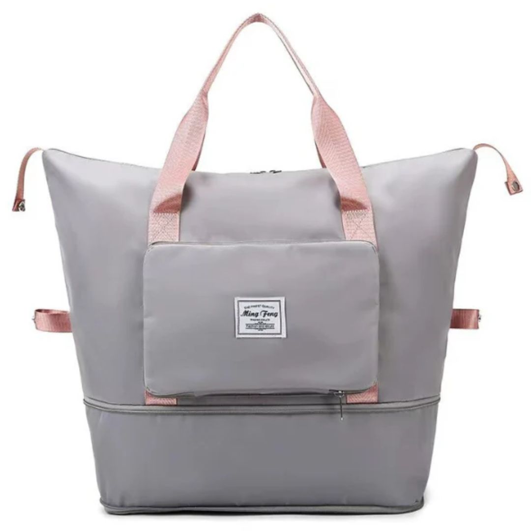 Graue Reisetasche mit rosa Griffen, großer Stauraum, Reißverschlusstasche, strapazierfähiges Material.