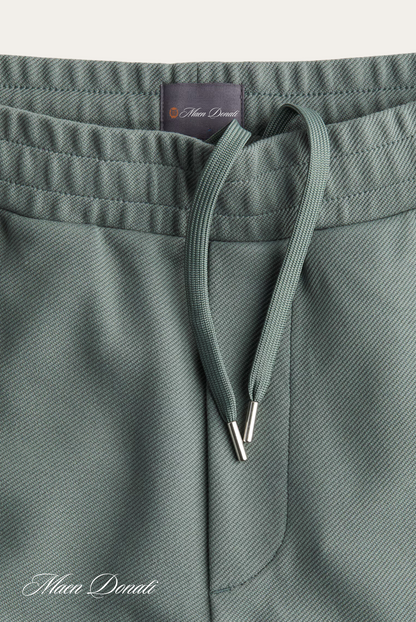 Grüne Jogginghose aus Baumwolle mit Kordelzug, bequeme Sportbekleidung für Herren.