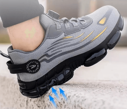 Grauer Sportschuh mit dicker Sohle, atmungsaktivem Mesh, ideal für Laufen und Fitness.