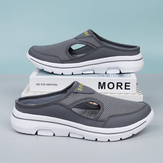 Graue Herren-Sportschuhe, atmungsaktiv, rutschfest, mit weißer Sohle, ideal für Freizeitaktivitäten.