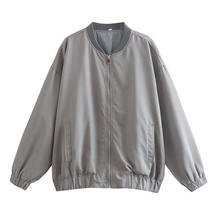 Graue oversized Damenjacke, Herbstmode, Reißverschluss, lässiger Stil, Rippbündchen.