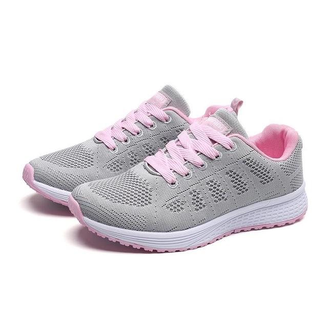 Graue Damen-Sneaker mit rosa Akzenten, atmungsaktiv, leicht, ideal für Outdoor-Aktivitäten.