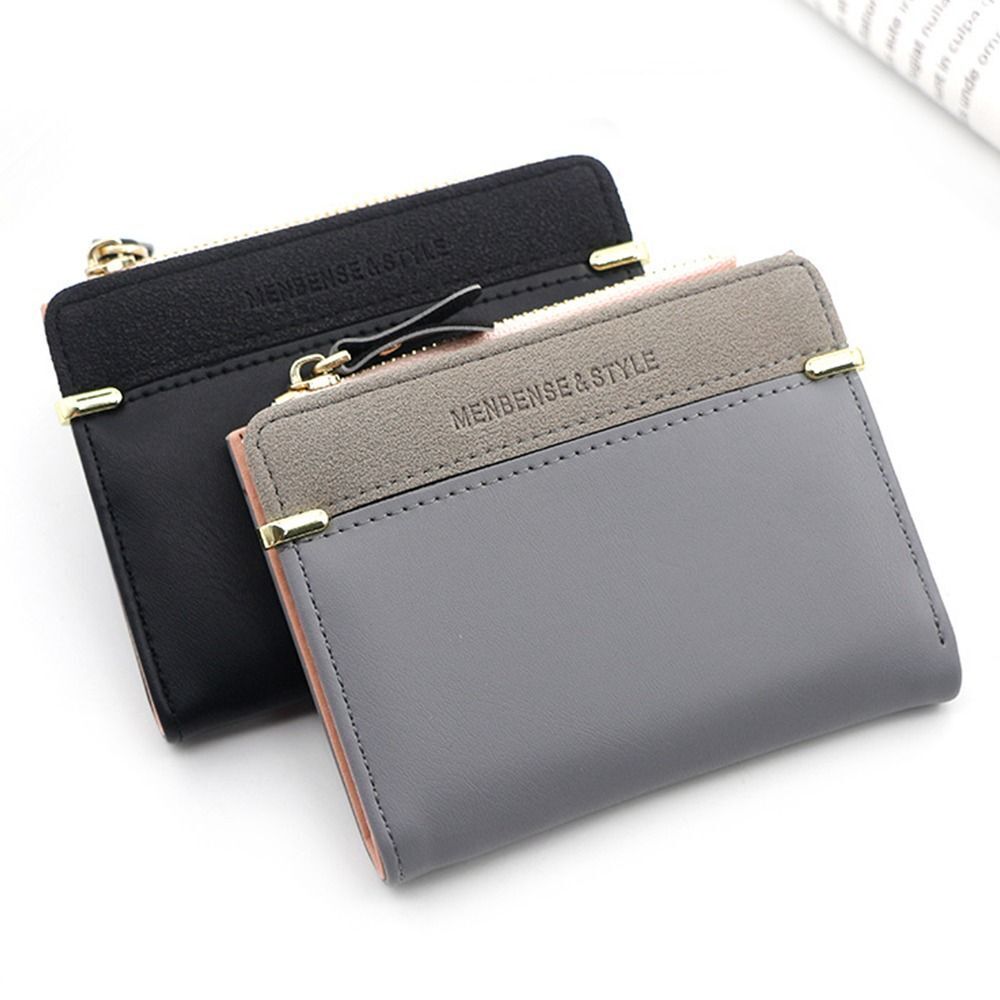 Graue und schwarze Mini-Kartenetuis aus Leder mit Reißverschluss, stilvolles Design.
