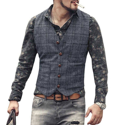 Mann in grauer Weste, Blumenhemd, Jeans, mit Uhr und Zigarette, modischer Freizeitlook.