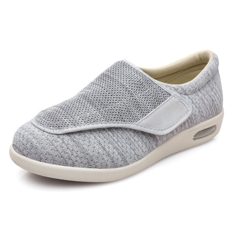 Grauer orthopädischer Damenschuh, atmungsaktiv, Klettverschluss, bequeme Sohle.