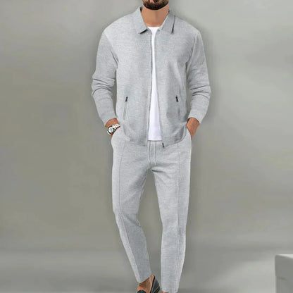 Grauer Herren-Trainingsanzug, Reißverschlussjacke, Jogginghose, Freizeitmode, Sportbekleidung.