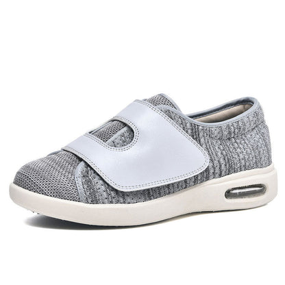 Grauer orthopädischer Schuh mit Klettverschluss, atmungsaktiv, bequem, für Damen und Herren.