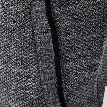 Grauer Strickstoff, Nahaufnahme, Textur, weiches Material, Mode, Bekleidung, Detailansicht.