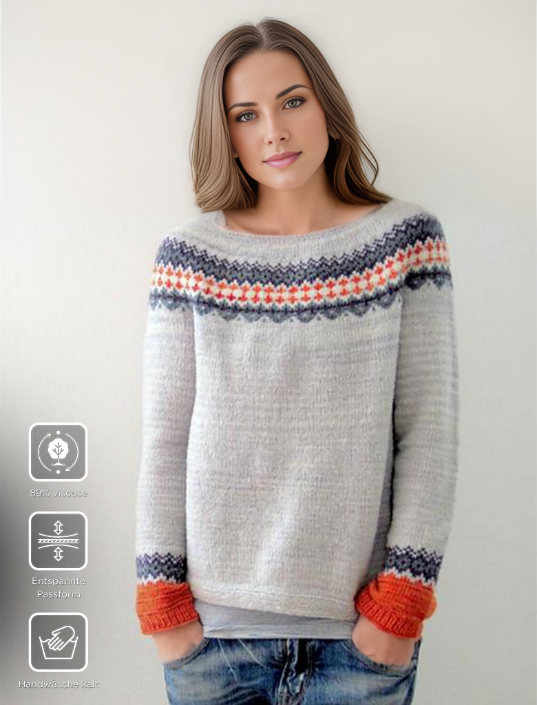 Frau trägt grauen Strickpullover mit buntem Muster, 85% Wolle, entspannte Passform.