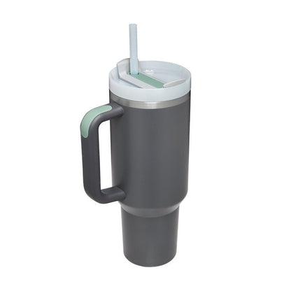 Grauer Thermobecher mit Henkel und Strohhalm, doppelwandig, ideal für heiße und kalte Getränke.