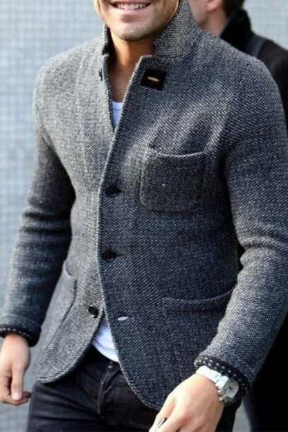 Grauer Herrenblazer aus Wolle, elegantes Design, mit Knöpfen und Brusttasche.